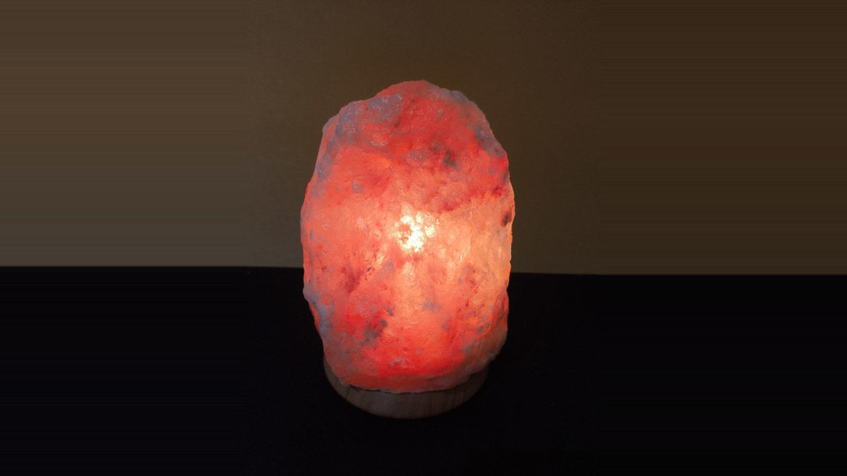 A warm red lamp glowing softly in a dark room