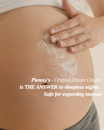 Close-up of Dream Cream being massaged onto a pregnant belly