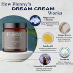 Pregnant mom in a black cardigan holding Original Dream Cream on her bare belly