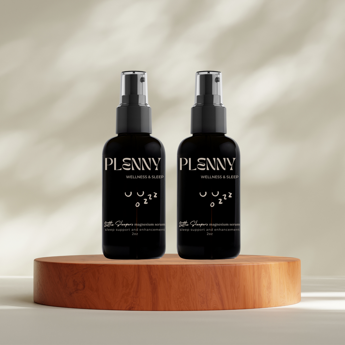 Two bottles of Little Sleepers magnesium serum on a wooden stand, 100 Days of Sleep bundle